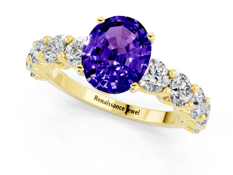 Yellow gold Oval Cut Tanzanite Prong Setting with Side Stones on a Pave Band_1
