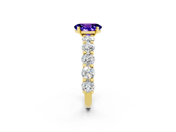 Yellow gold Oval Cut Tanzanite Prong Setting with Side Stones on a Pave Band