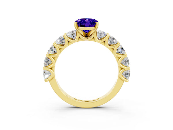 Yellow gold Oval Cut Tanzanite Prong Setting with Side Stones on a Pave Band