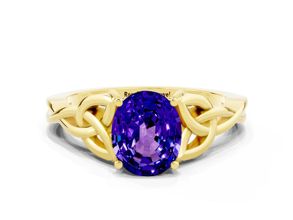 Yellow gold Oval Cut Tanzanite Solitaire Celtic Knot Ring with Four-Prong Setting