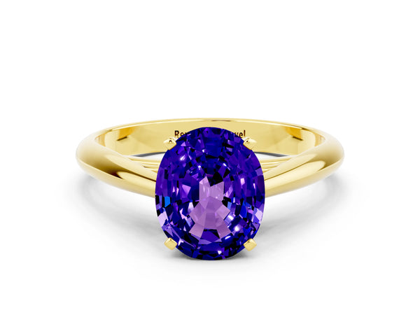 Yellow gold Oval Cut Tanzanite Solitaire Engagement Ring with Cathedral Setting and Four-Prong Mount