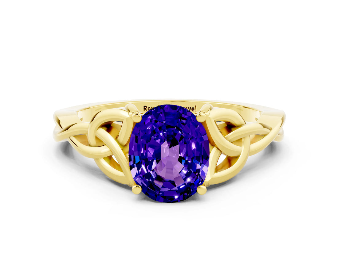 Yellow gold Oval Cut Tanzanite Solitaire Engagement Ring with Celtic Knot Band and Four-Prong Setting