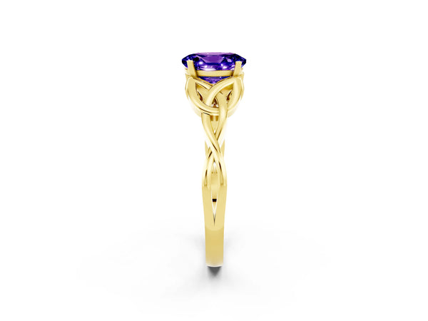 Yellow gold Oval Cut Tanzanite Solitaire Engagement Ring with Celtic Knot Band and Four-Prong Setting