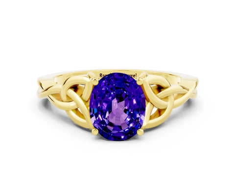 Yellow gold Oval Cut Tanzanite Solitaire Engagement Ring with Celtic Knot Band and Four-Prong Setting