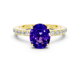 Yellow gold Oval Cut Tanzanite Solitaire Engagement Ring with Pavé Band and Four-Prong Setting