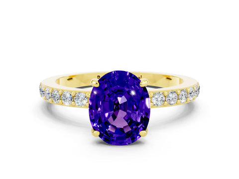 Yellow gold Oval Cut Tanzanite Solitaire Engagement Ring with Pavé Band and Four-Prong Setting