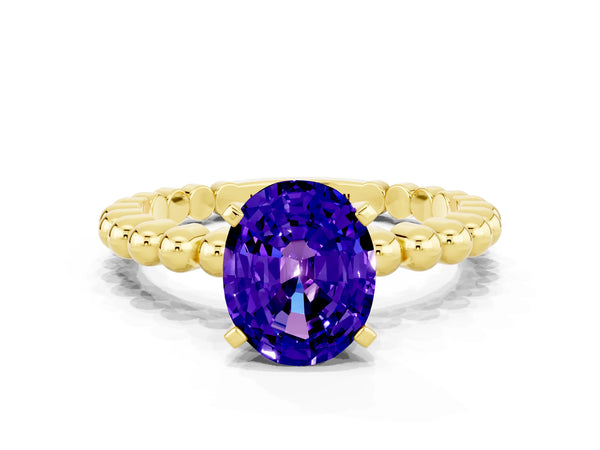 Yellow gold Oval Cut Tanzanite Solitaire Ring with Beaded Band and Prong Setting