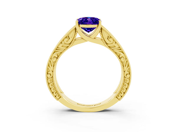 Yellow gold Oval Cut Tanzanite Solitaire Ring with Engraved Band and Four-Prong Setting