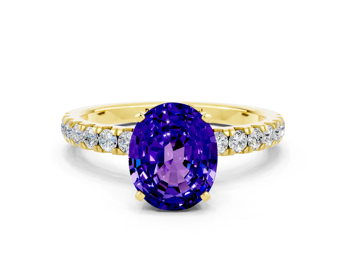 Yellow gold Oval Cut Tanzanite Solitaire Ring with Pavé Accents and Four-Prong Setting