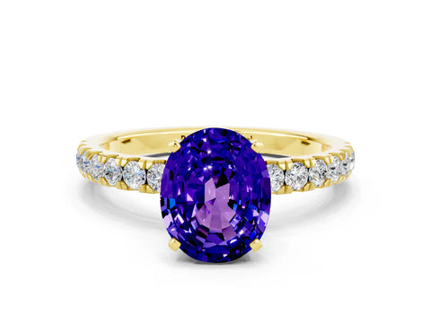 Yellow gold Oval Cut Tanzanite Solitaire Ring with Pavé Accents and Four-Prong Setting