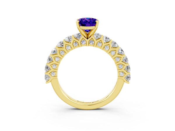 Yellow gold Oval Cut Tanzanite Solitaire Ring with Shared Prong Pavé Band and Four-Prong Setting