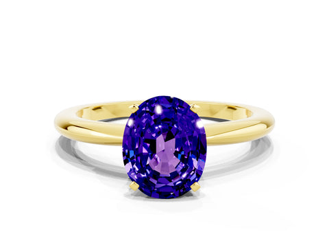 Yellow gold Oval Cut Tanzanite Solitaire Ring with Six-Prong Setting and Classic Band