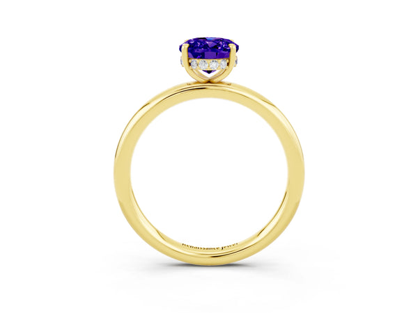 Yellow gold Oval Cut Tanzanite Solitaire Ring with Thin Band and Four-Prong Setting