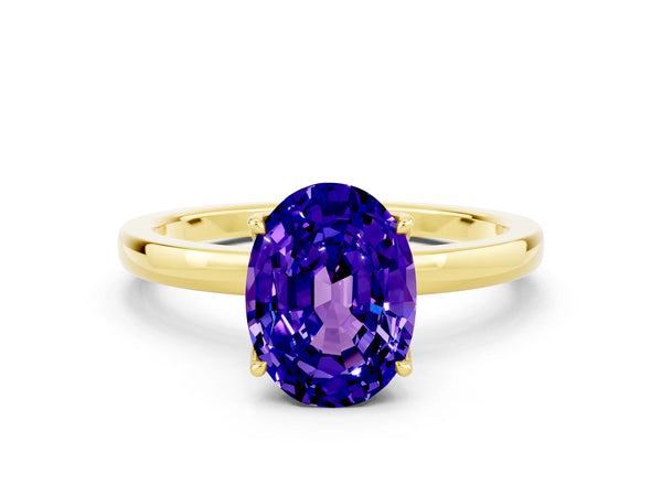 Yellow gold Oval Cut Tanzanite Solitaire Ring with Thin Band and Prong Setting