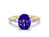 Yellow gold Oval Cut Tanzanite Solitaire with Side Baguettes and Channel Set Band