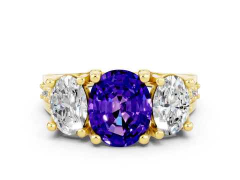 Yellow gold Oval Cut Tanzanite Three-Stone Ring with Channel Set Band and Four-Prong Setting