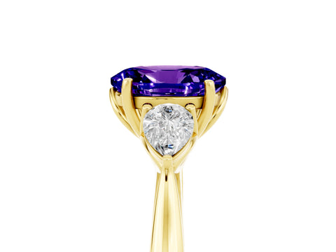 Yellow gold Oval Cut Tanzanite Three-Stone Ring with Pear Side Stones and Four-Prong Setting_17
