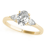 Yellow gold Oval Cut Three-Stone Diamond Ring with Pear Side Stones on a Classic Solitaire Band with Prong Setting