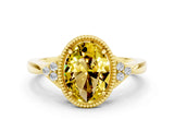 Yellow gold Oval Cut Yellow Sapphire Halo Ring with Tapered Band and Four-Prong Setting
