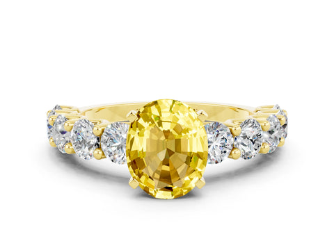 Yellow gold Oval Cut Yellow Sapphire Prong Setting with Side Stones on a Pave Band_24