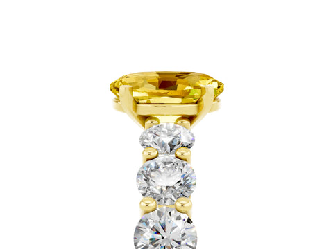 Yellow gold Oval Cut Yellow Sapphire Prong Setting with Side Stones on a Pave Band_29