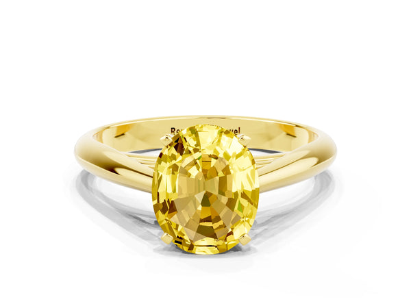 Yellow gold Oval Cut Yellow Sapphire Solitaire Engagement Ring with Cathedral Setting and Four-Prong Mount