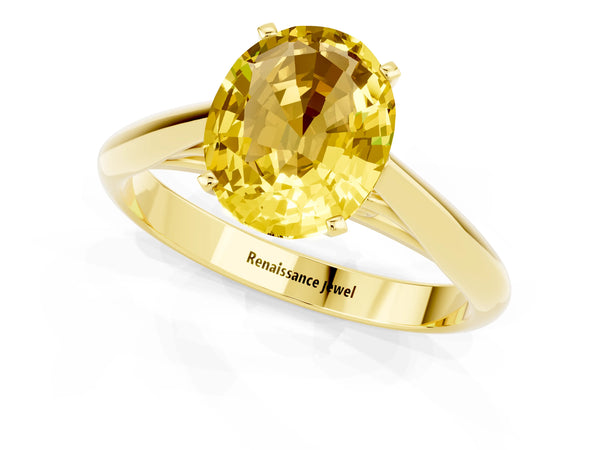 Yellow gold Oval Cut Yellow Sapphire Solitaire Engagement Ring with Cathedral Setting and Four-Prong Mount