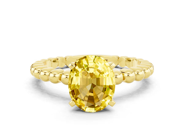 Yellow gold Oval Cut Yellow Sapphire Solitaire Ring with Beaded Band and Prong Setting