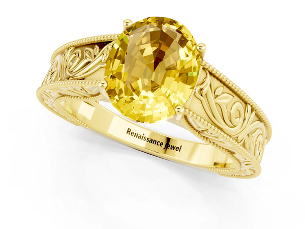 Yellow gold Oval Cut Yellow Sapphire Solitaire Ring with Engraved Band and Four-Prong Setting