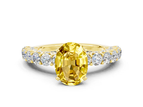 Yellow gold Oval Cut Yellow Sapphire Solitaire Ring with Shared Prong Pavé Band and Four-Prong Setting