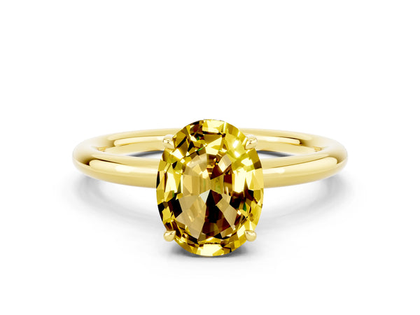 Yellow gold Oval Cut Yellow Sapphire Solitaire Ring with Thin Band and Four-Prong Setting