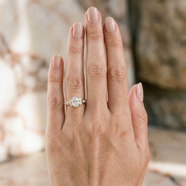 Yellow gold Oval Diamond Bezel and Prong Setting with Pave Band