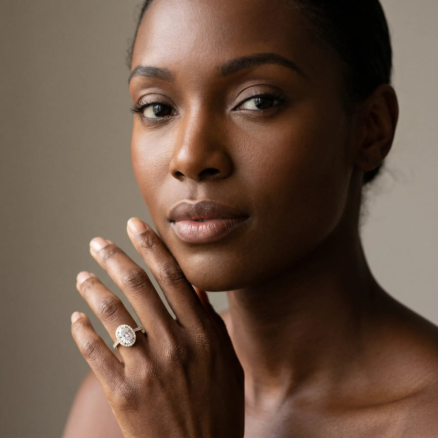 Yellow gold Oval Diamond Halo Ring with Pavé Band and Prong Setting