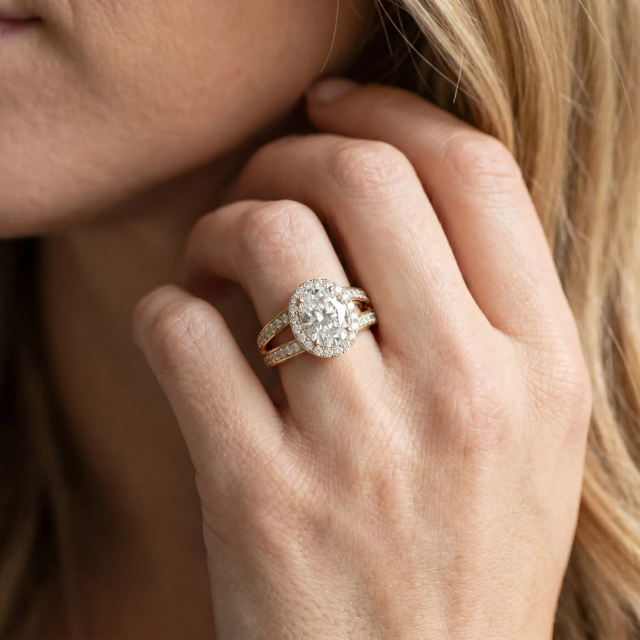 Yellow gold Oval Diamond Halo Ring with Split Shank Pavé Band and Four-Prong Setting