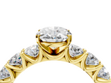 Yellow gold Oval Diamond Prong Setting with Side Stones on a Pave Band_135