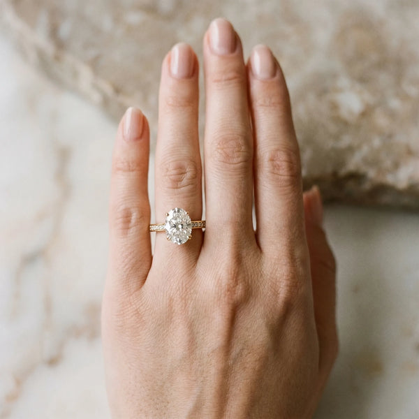 Yellow gold Oval Diamond Solitaire with Pave Band and Six-Prong Setting