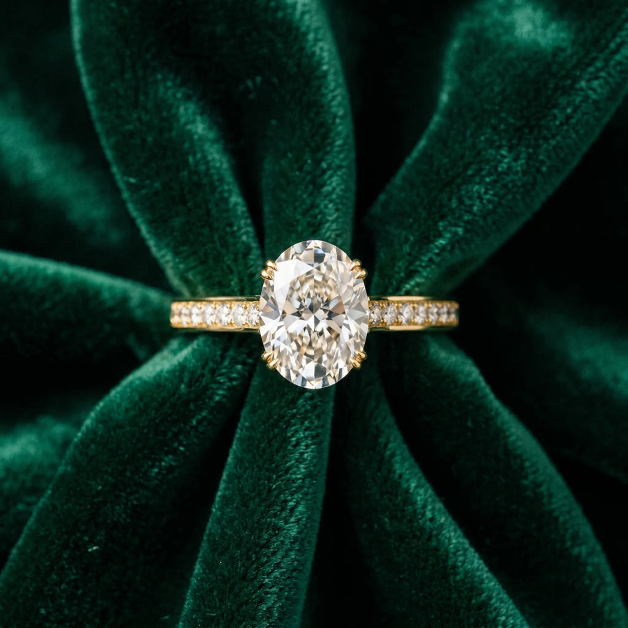 Yellow gold Oval Diamond Solitaire with Pave Band and Six-Prong Setting