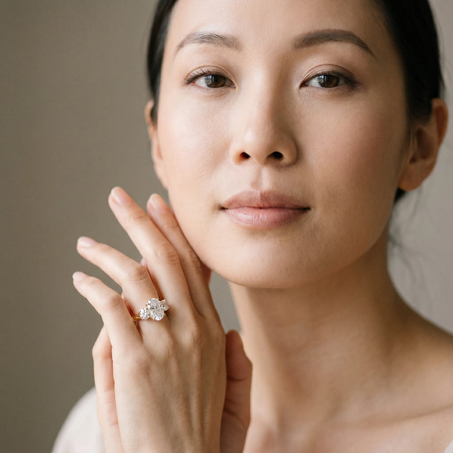 Yellow gold Oval Diamond Three-Stone Ring with Prong Setting and Textured Band