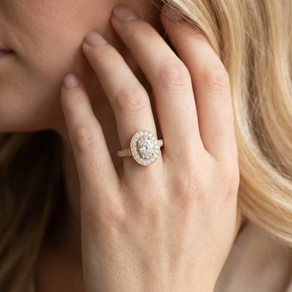 Yellow gold Oval Halo Diamond Engagement Ring with Pave Band and Four-Prong Setting