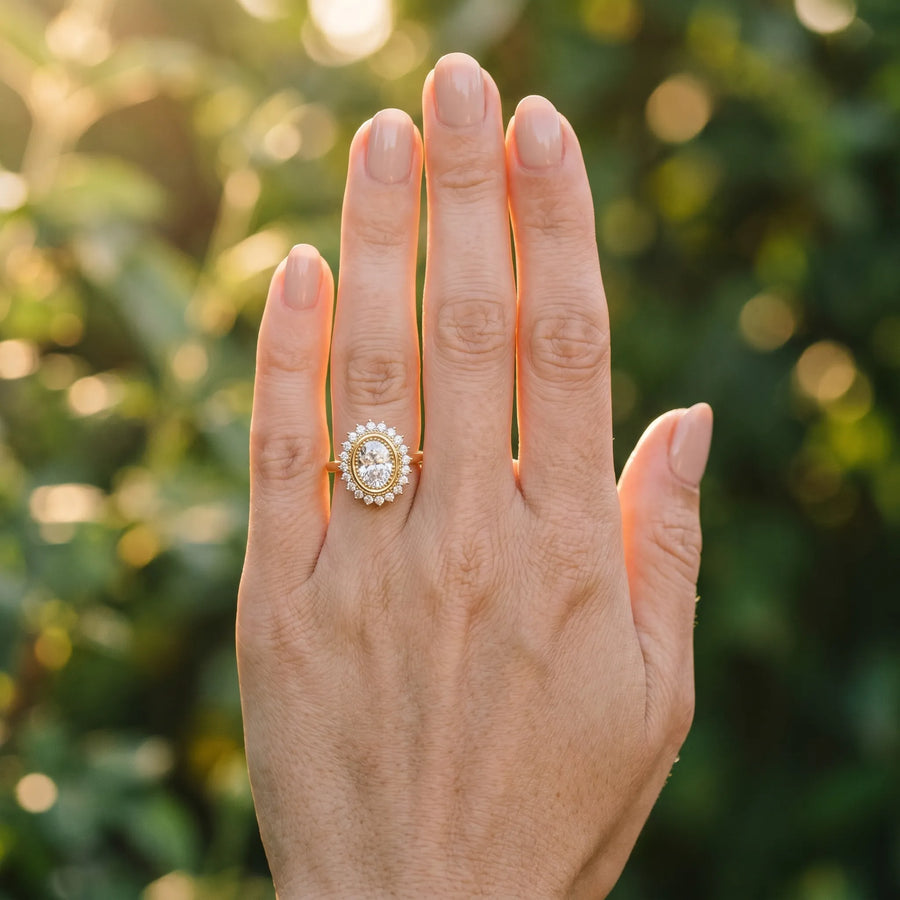 Yellow gold Oval Halo Diamond Ring with Milgrain Edge and Round Prong Setting