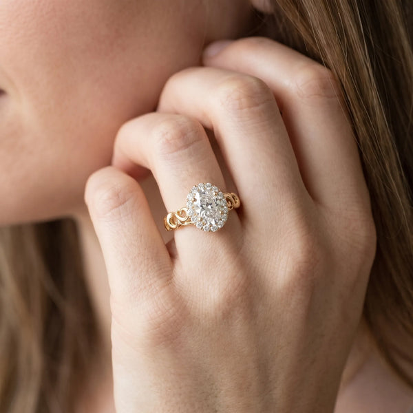 Yellow gold Oval Halo Diamond Ring with Scrollwork Band and Four-Prong Setting