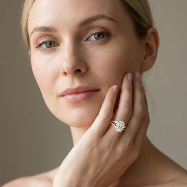 Yellow gold Oval Halo Split Shank Pave Diamond Ring with Four-Prong Setting