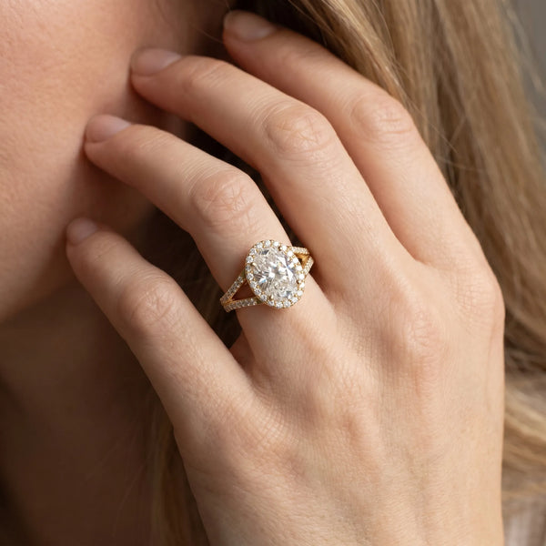 Yellow gold Oval Halo Split Shank Pave Diamond Ring with Four-Prong Setting
