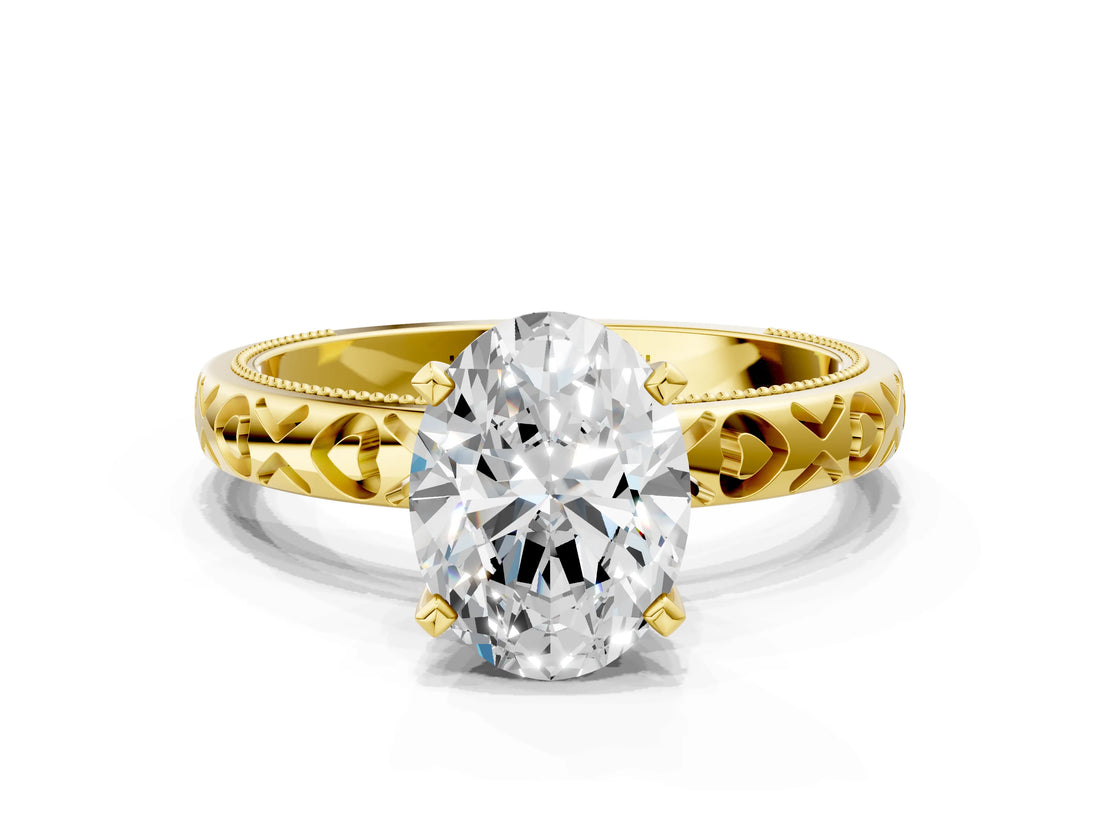 Yellow gold Oval Solitaire Diamond Engagement Ring with XO Engraved Band and Four-Prong Setting