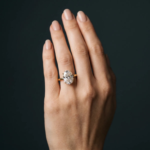 Yellow gold Oval Solitaire Diamond Ring with Thin Band and Four-Prong Setting