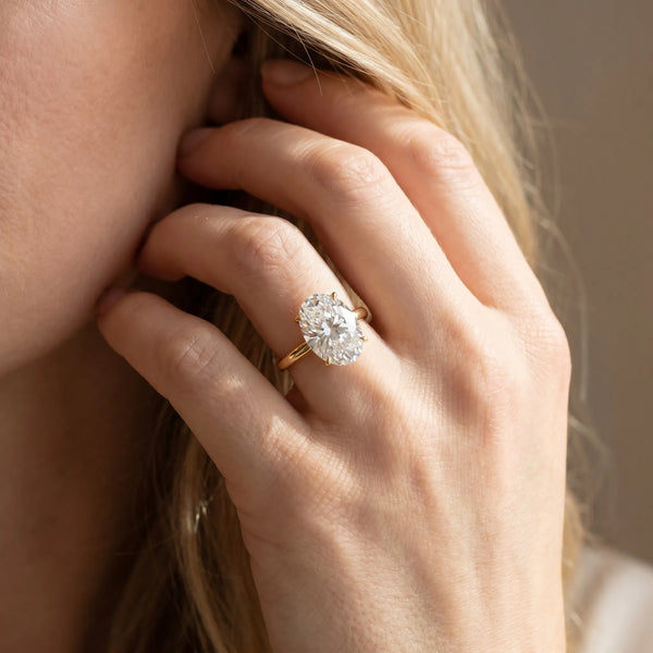 Yellow gold Oval Solitaire Diamond Ring with Thin Band and Four-Prong Setting