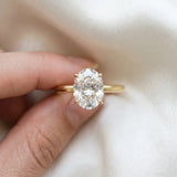 Yellow gold Oval Solitaire Engagement Ring with Cathedral Band and Four-Prong Setting_59