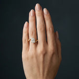 Yellow gold Oval Solitaire Twist Band with Pave Set Diamonds and Four-Prong Setting_175