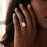 Yellow gold Oval Solitaire Twist Band with Pave Set Diamonds and Four-Prong Setting_177