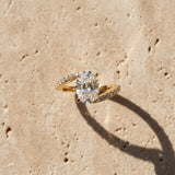 Yellow gold Oval Solitaire Twist Band with Pave Set Diamonds and Four-Prong Setting_178